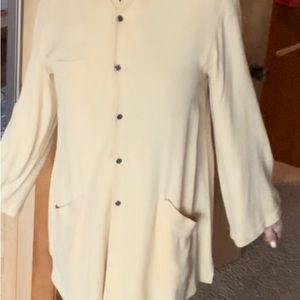 A gracefully flowing A-line tunic that adds a refined touch to any outfit.